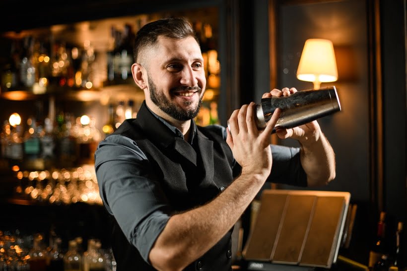 Bartender shaking mixer drink